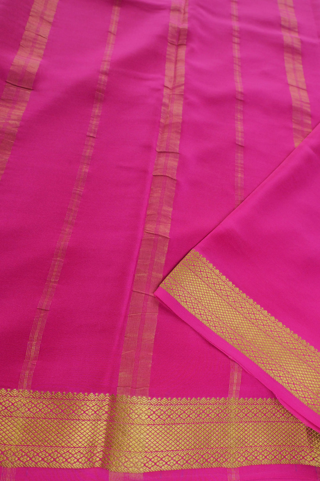 Purple mysore silk saree with pink contrast pallu and golden border