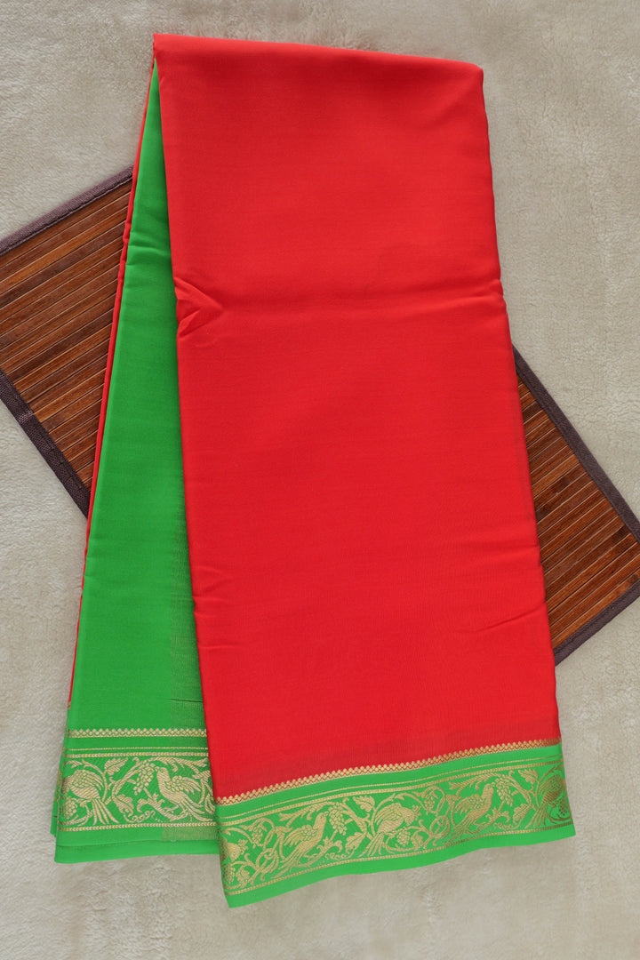 Red Mysore silk saree with vibrant green border and golden zari work