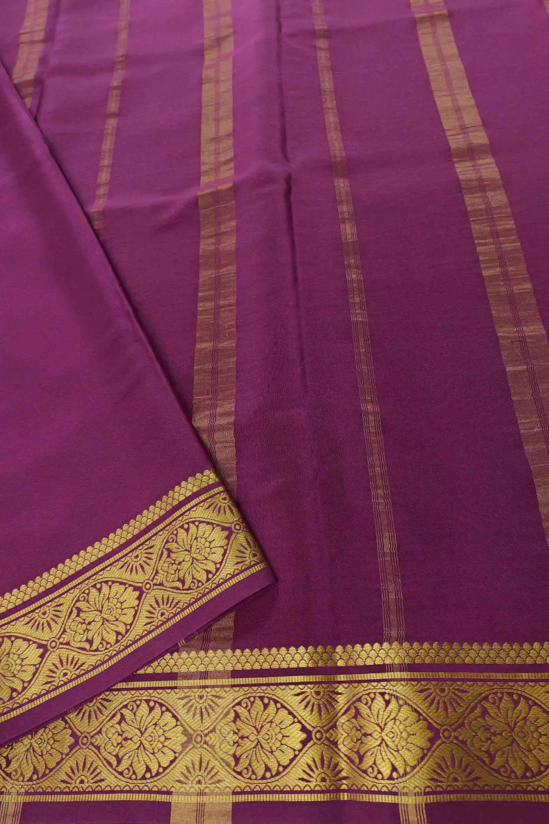 Soft green Mysore Silk saree paired with purple pallu