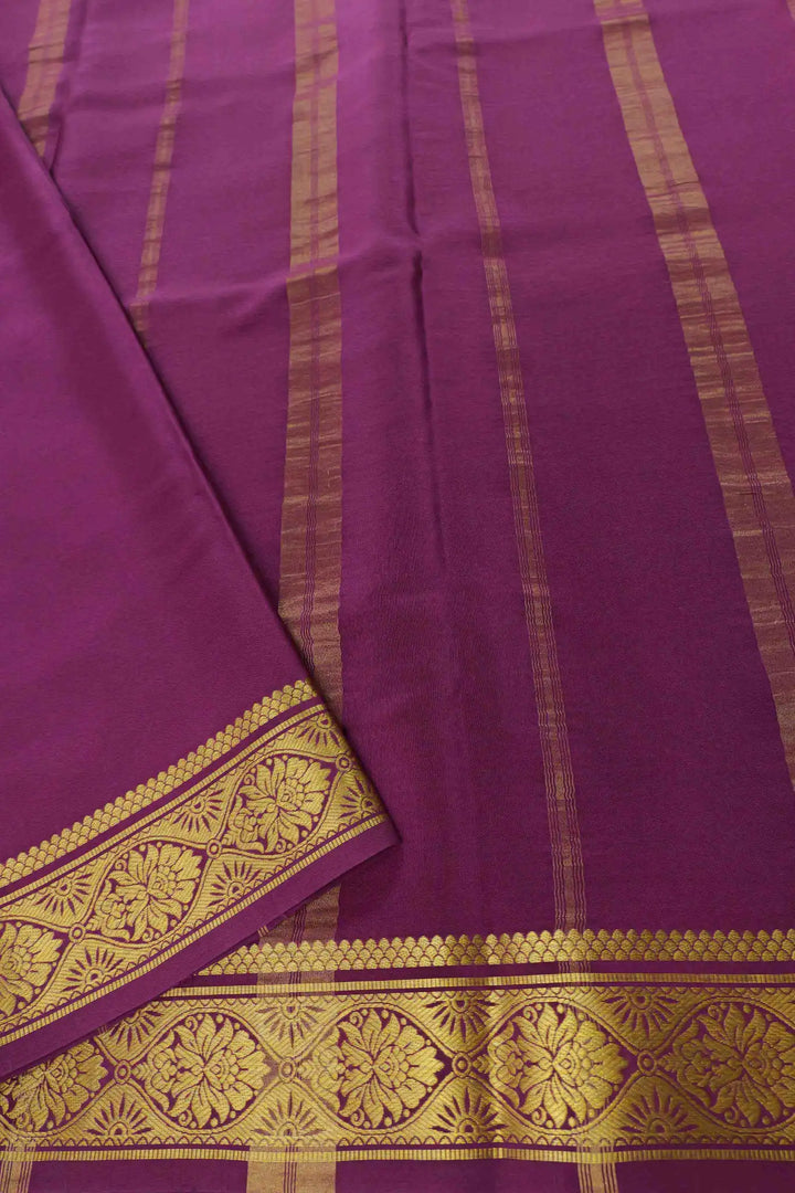 Soft green Mysore Silk saree paired with purple pallu
