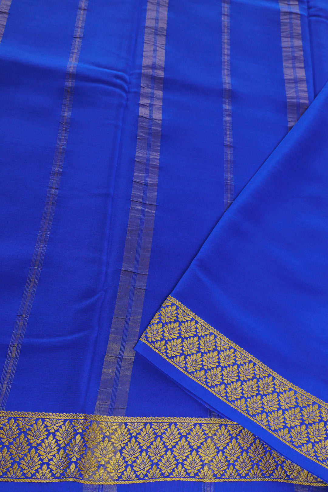Teal Mysore silk saree with blue border and gold design pallu