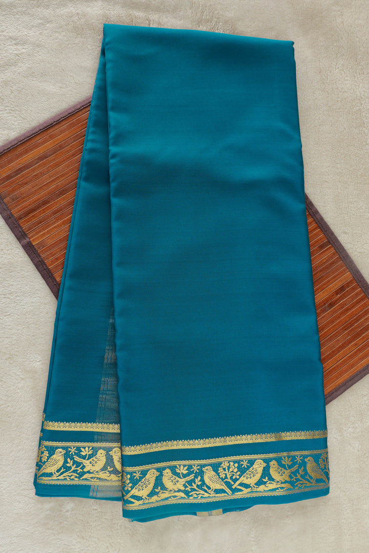 Teal Mysore silk saree with intricate gold zari border