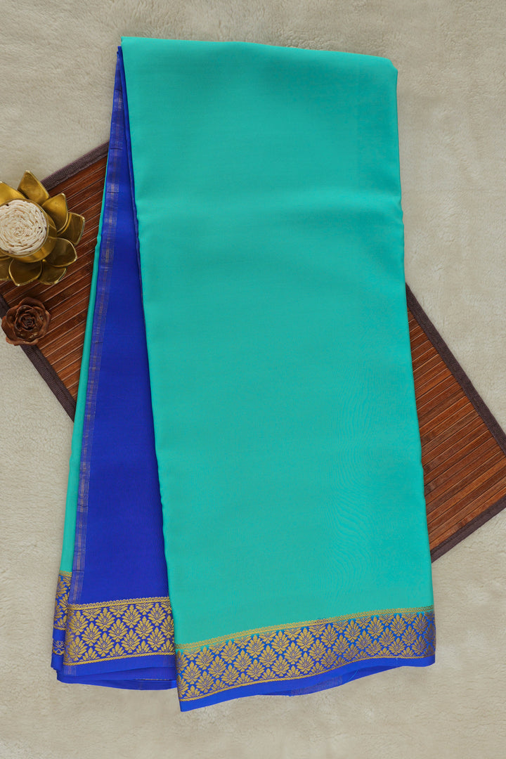 Teal Mysore silk saree with royal blue border and golden zari work