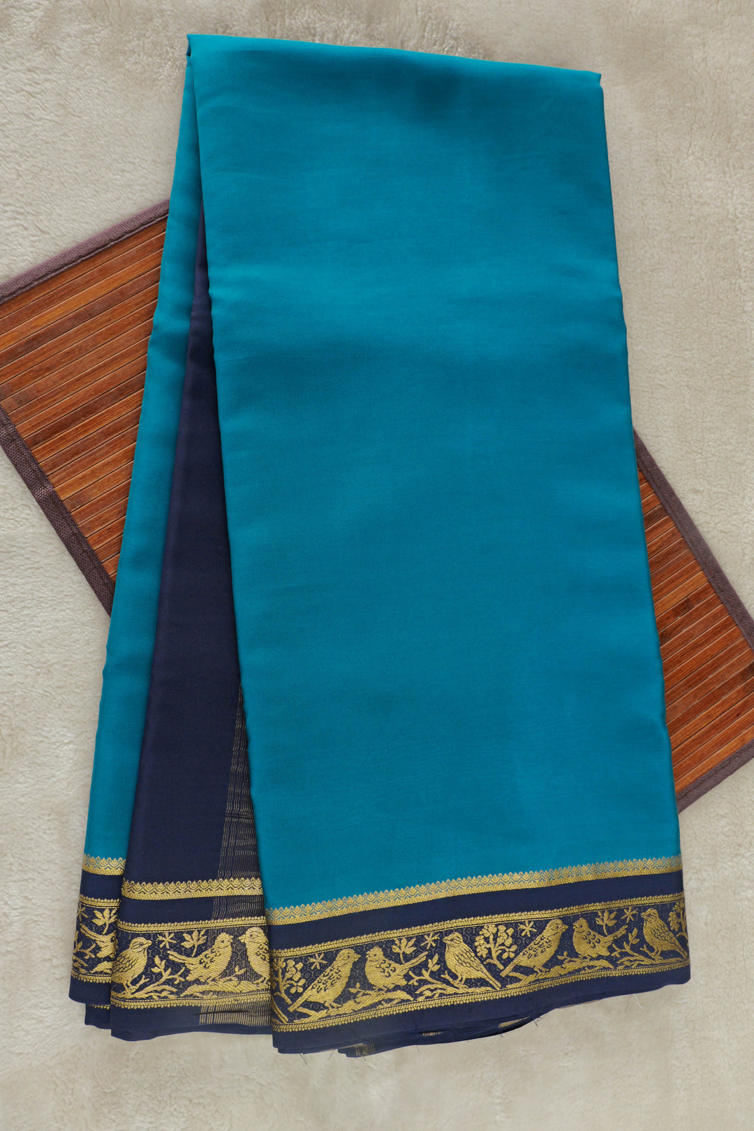 Teal blue Mysore silk saree with elegant navy and gold zari border