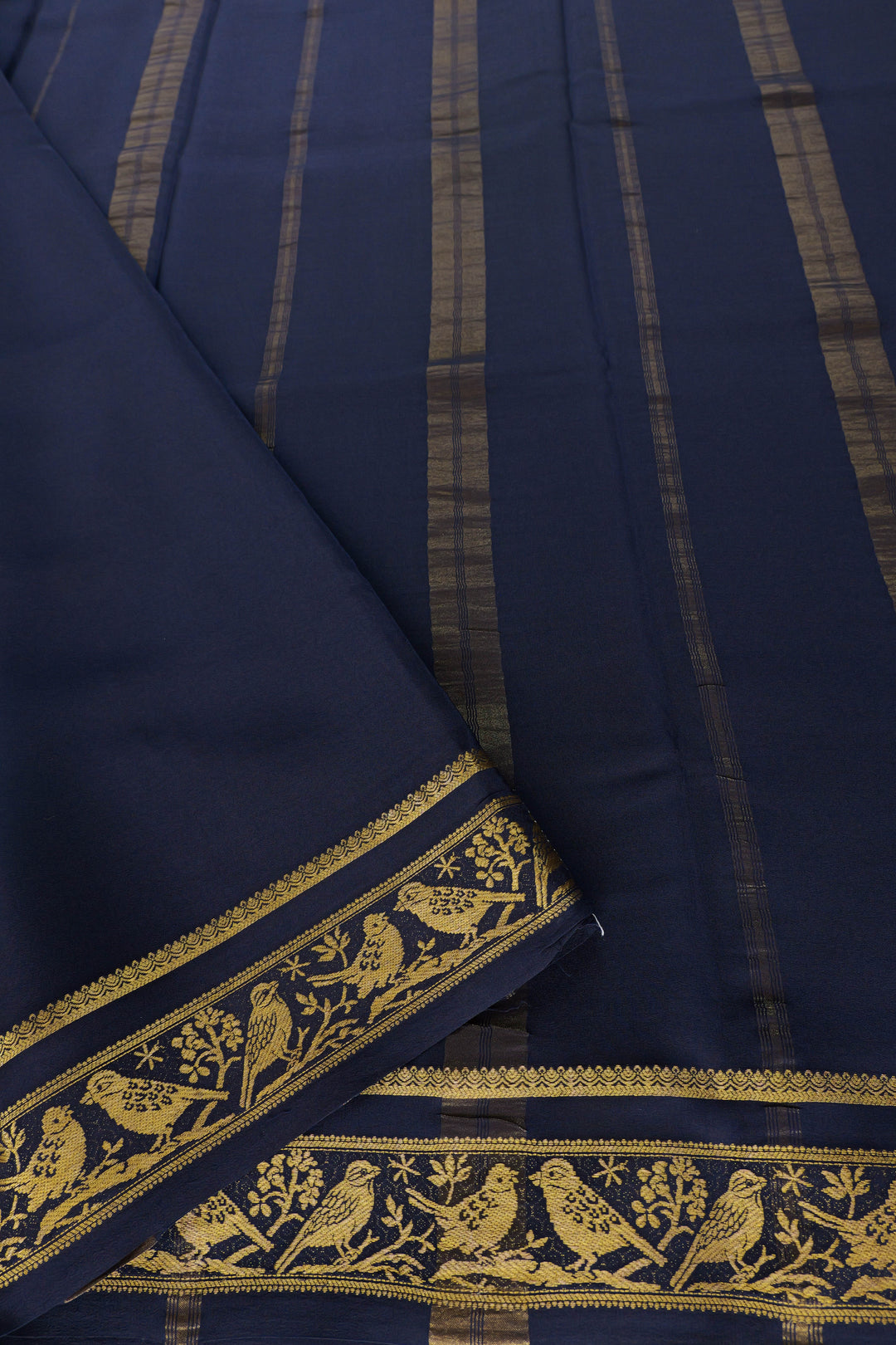 Teal blue Mysore silk saree with navy and gold zari parrot border