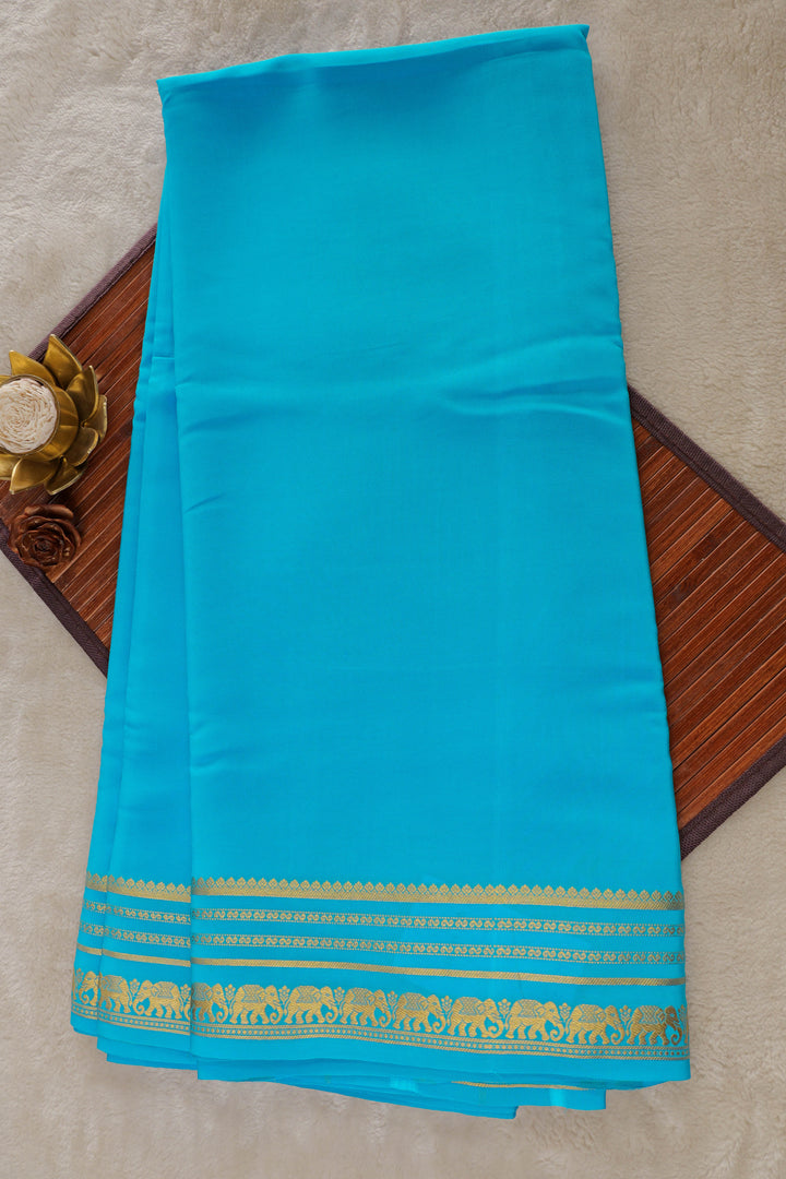 Turquoise Mysore silk saree with gold zari border