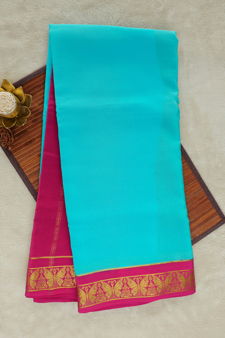 Turquoise Mysore silk saree with pink zari border