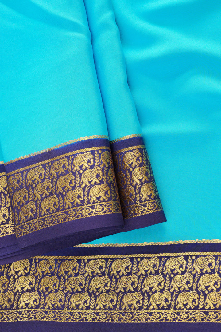 Turquoise blue Mysore silk saree with golden zari border and elephant motifs