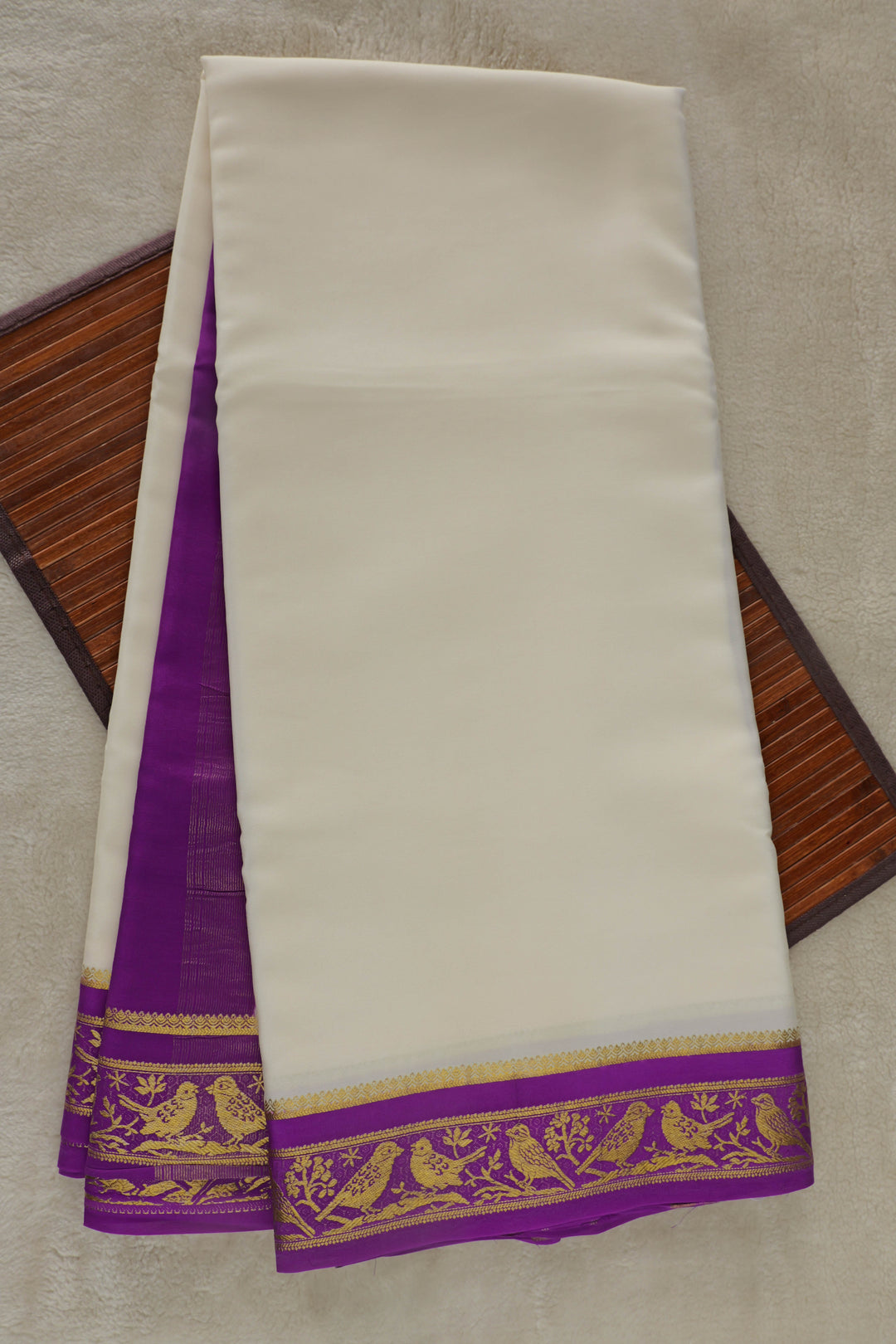 White Mysore silk saree with rich purple border and intricate gold zari design