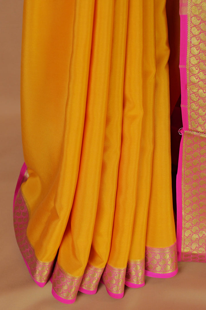 Yellow Mysore crepe silk saree with Contrast pink border – Atharva