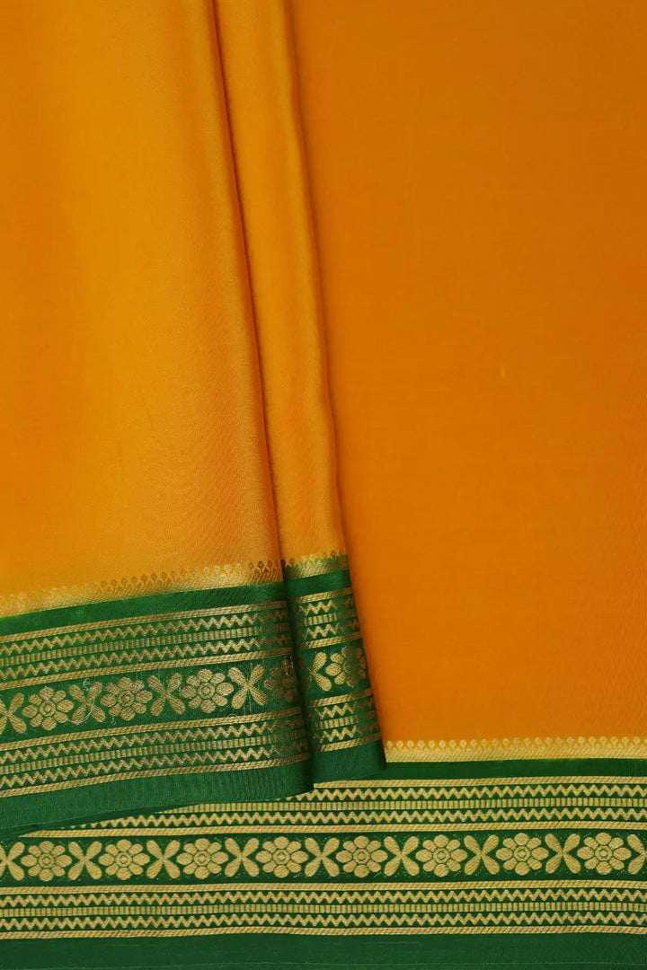 Yellow silk saree with contrast green border