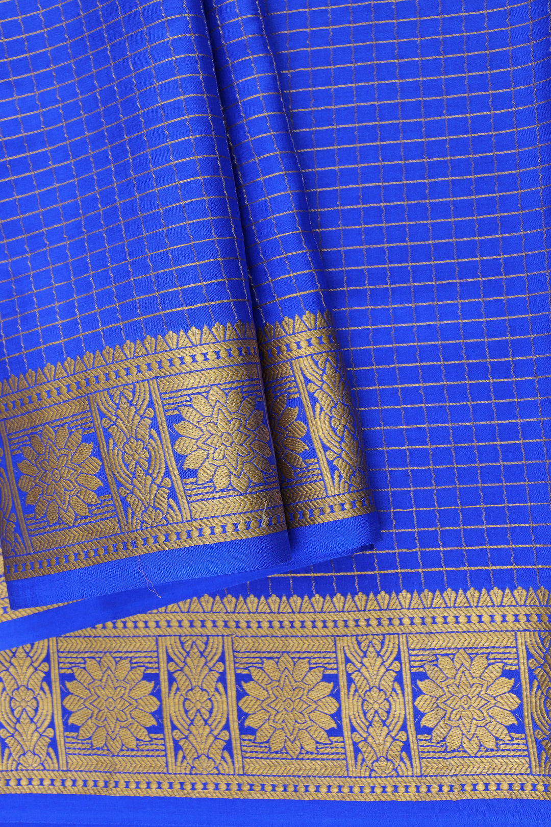 blue Mysore Silk crepe saree with gold-checkered body and floral border