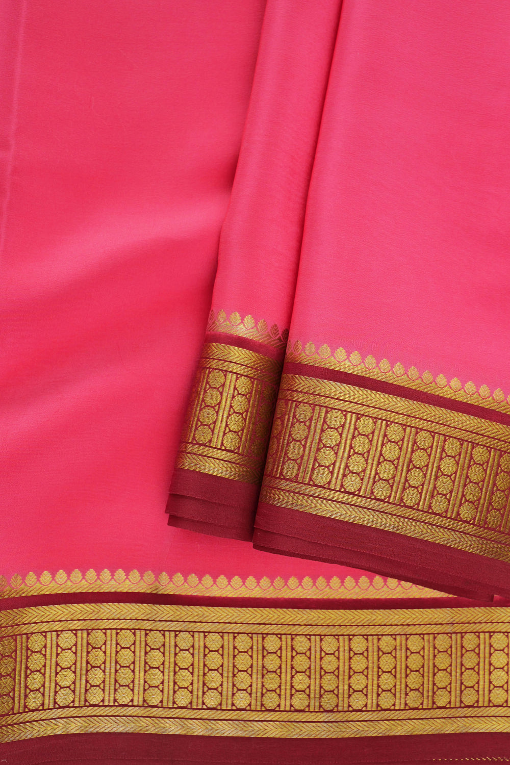 bright pink Mysore silk saree with detailed gold border