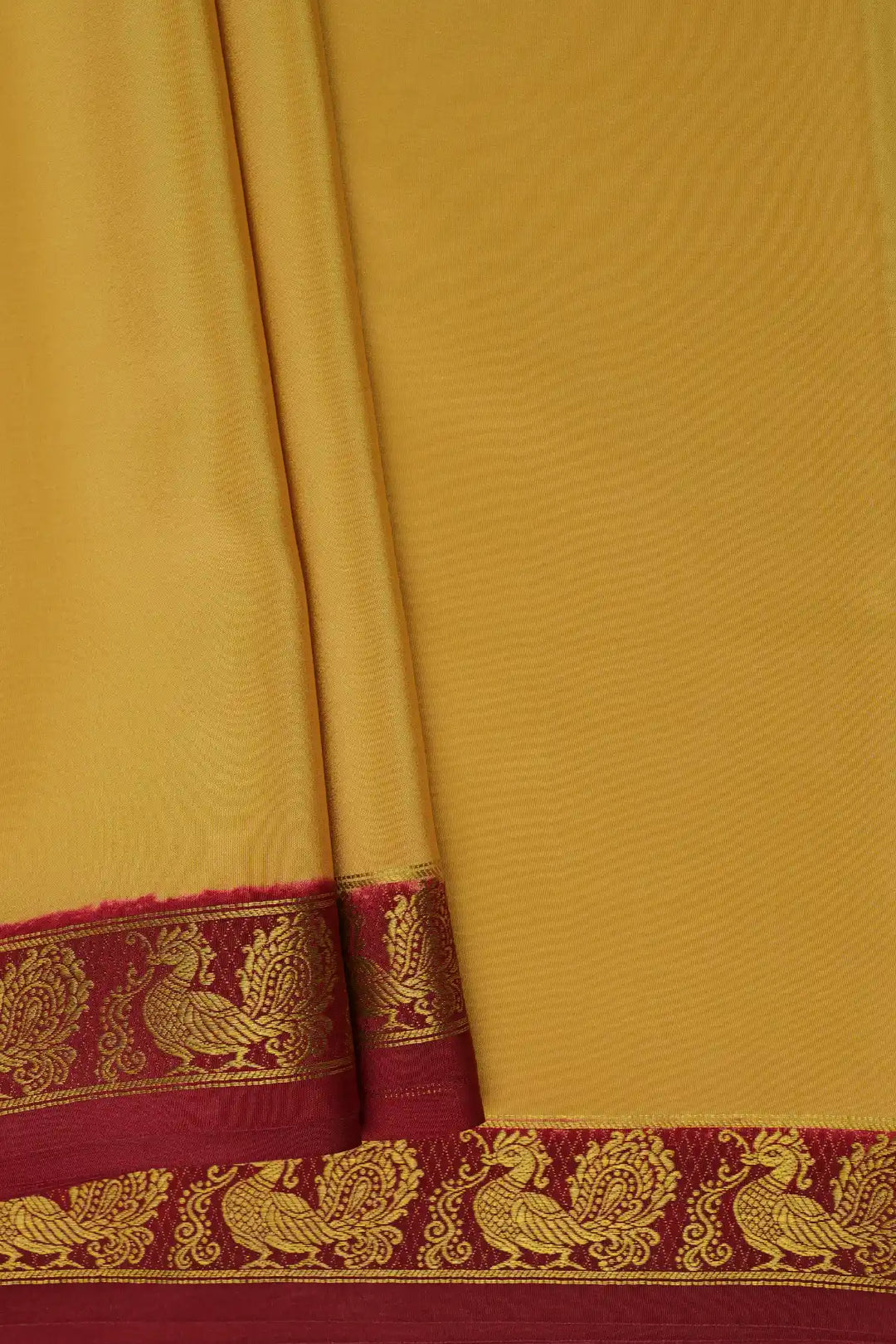 gold yellow mysore silk saree with brown peacock border 