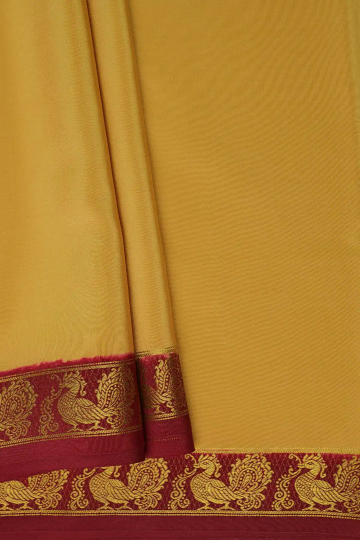 gold yellow mysore silk saree with brown peacock border 