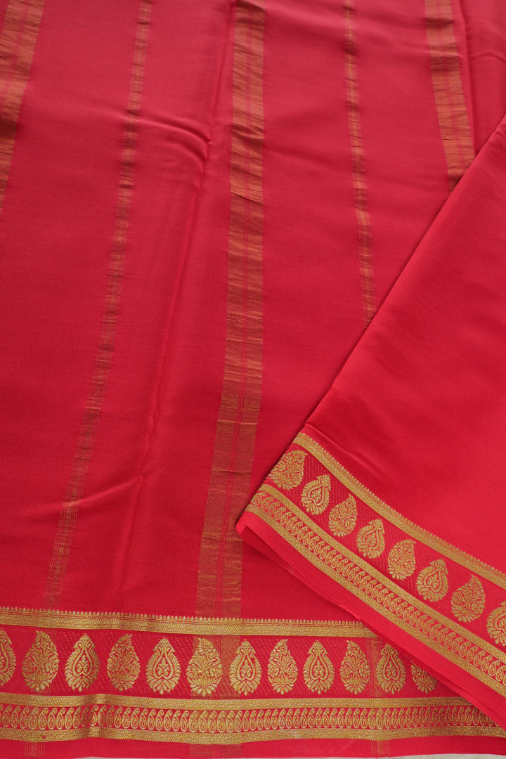 green Mysore silk saree with contrasting red and gold border pallu