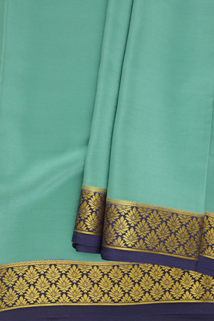 green Mysore silk saree with navy blue edging and golden work