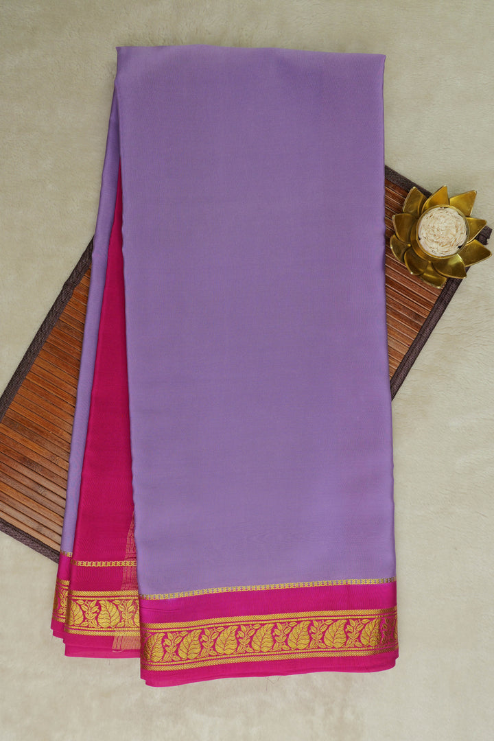 leaf bordered mysore silk sarees in lavender and contrasting pink blouse