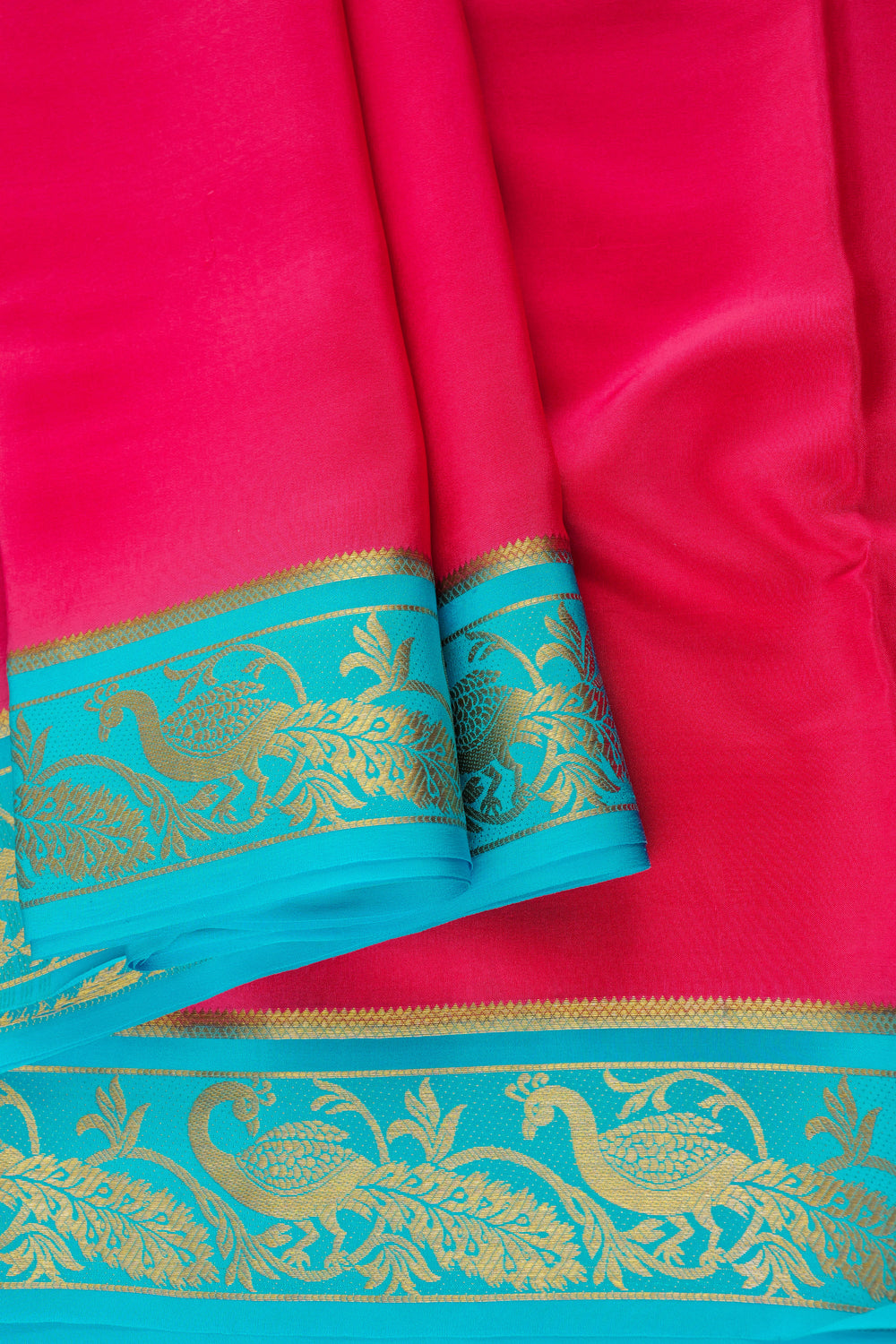 pink Mysore crepe silk saree with blue contrast border and fine golden embroidery
