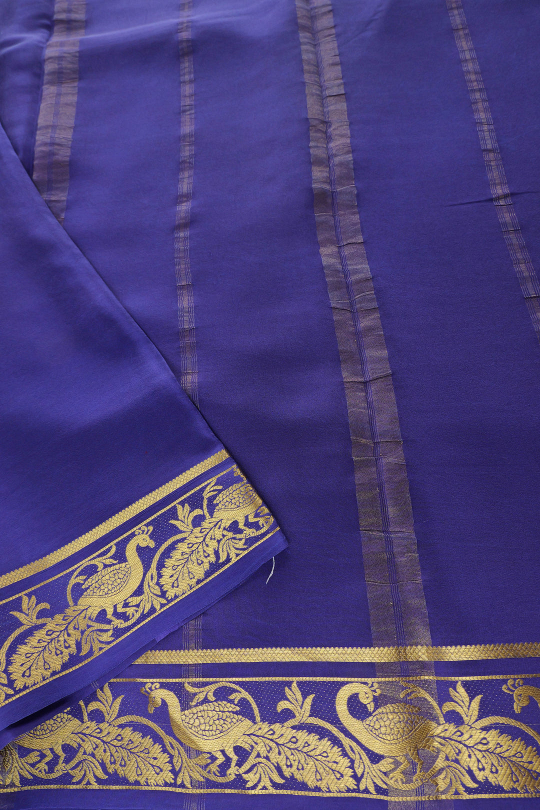 pink and blue silk saree with gold zari detailing