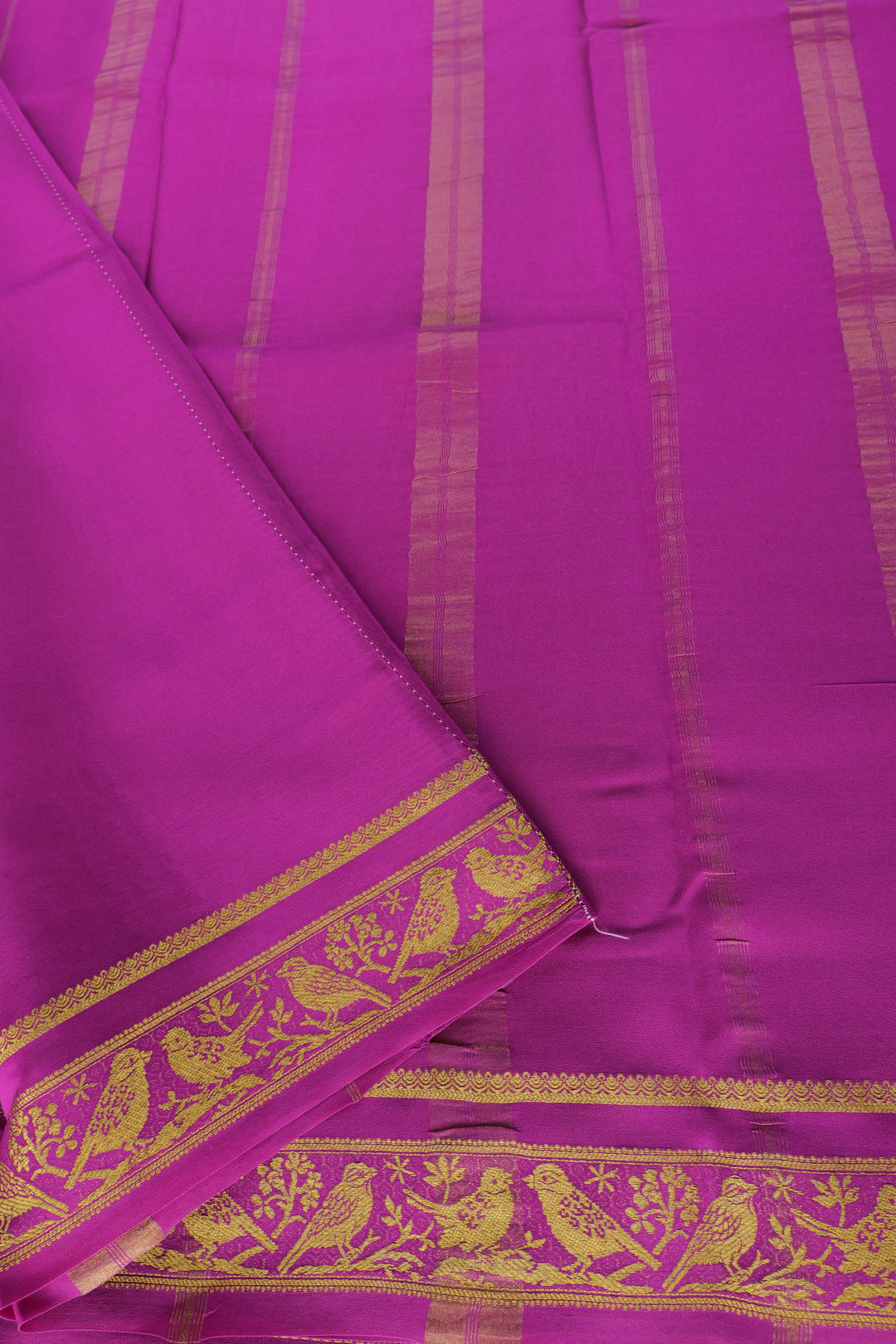 pink silk saree with gold pallu and sparrow border