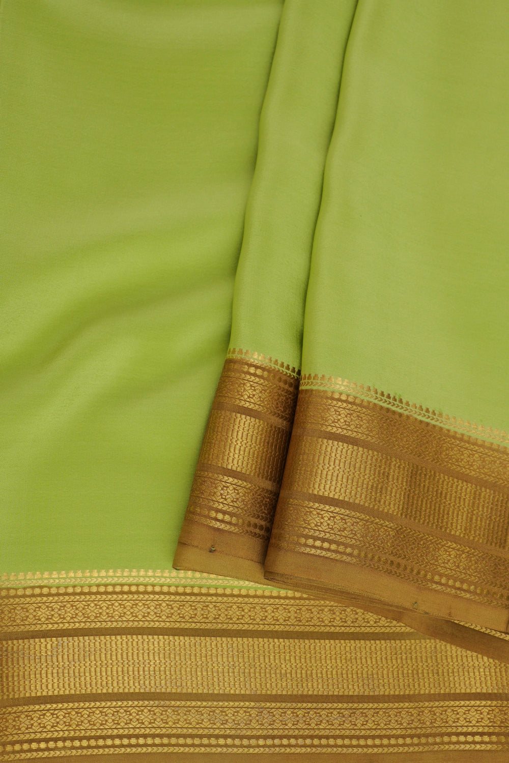 pure Mysore silk saree in pastel green with woven gold border and contrast blouse