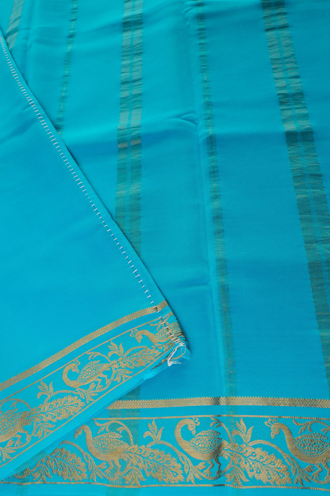 pure Mysore silk saree in vibrant red with turquoise blue pallu and gold peacock patterns