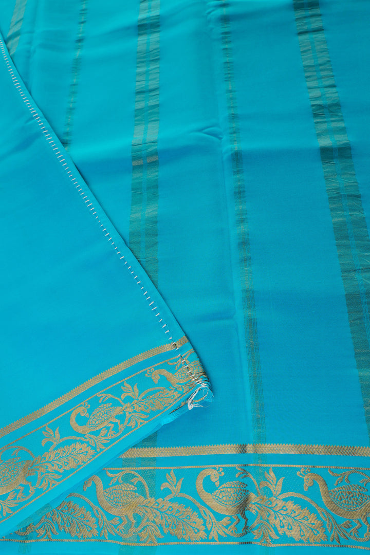 pure Mysore silk saree in vibrant red with turquoise blue pallu and gold peacock patterns