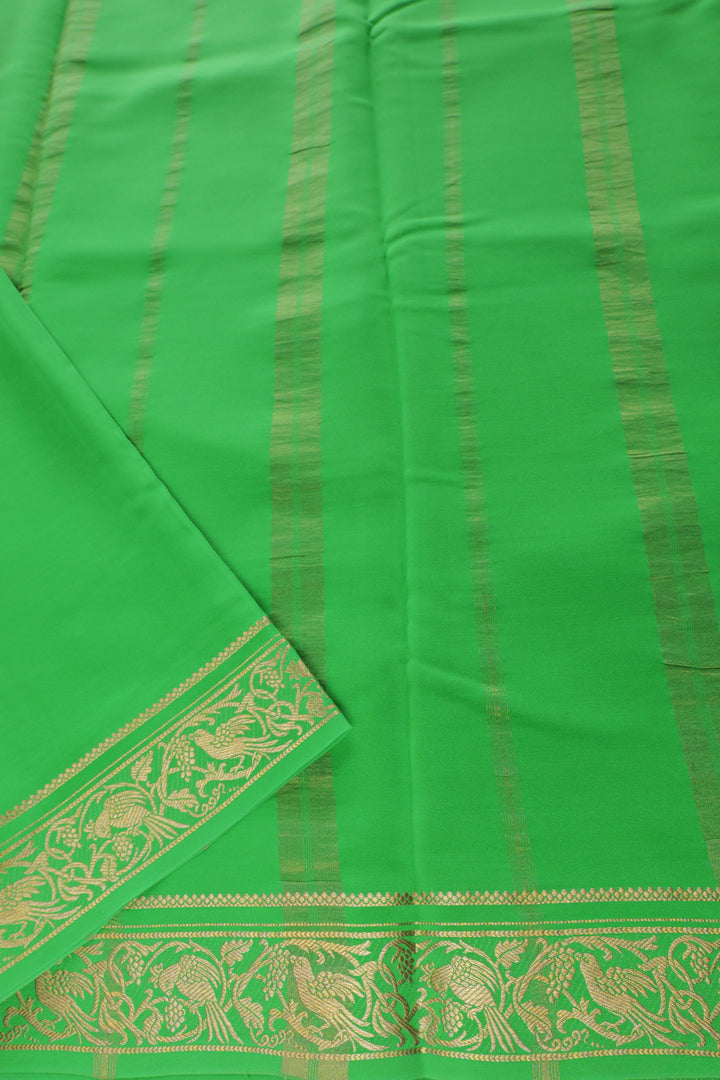 red Mysore silk saree featuring gold zari design and contrasting green pallu