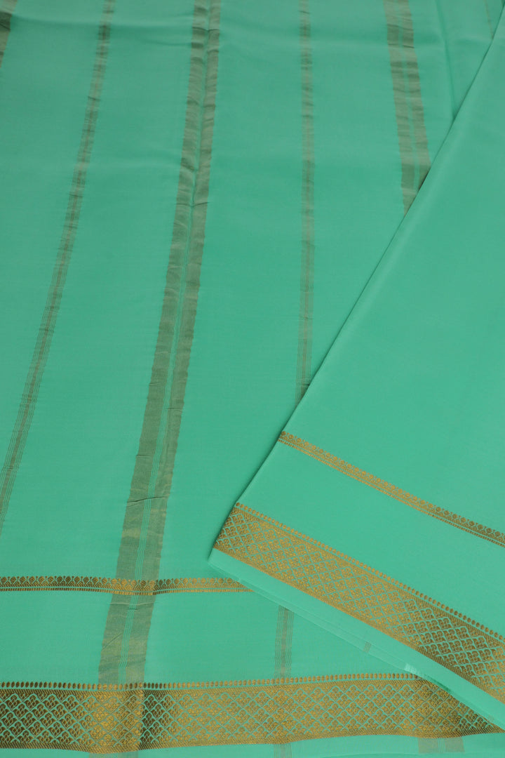turquoise Mysore silk saree with gold border and pallu