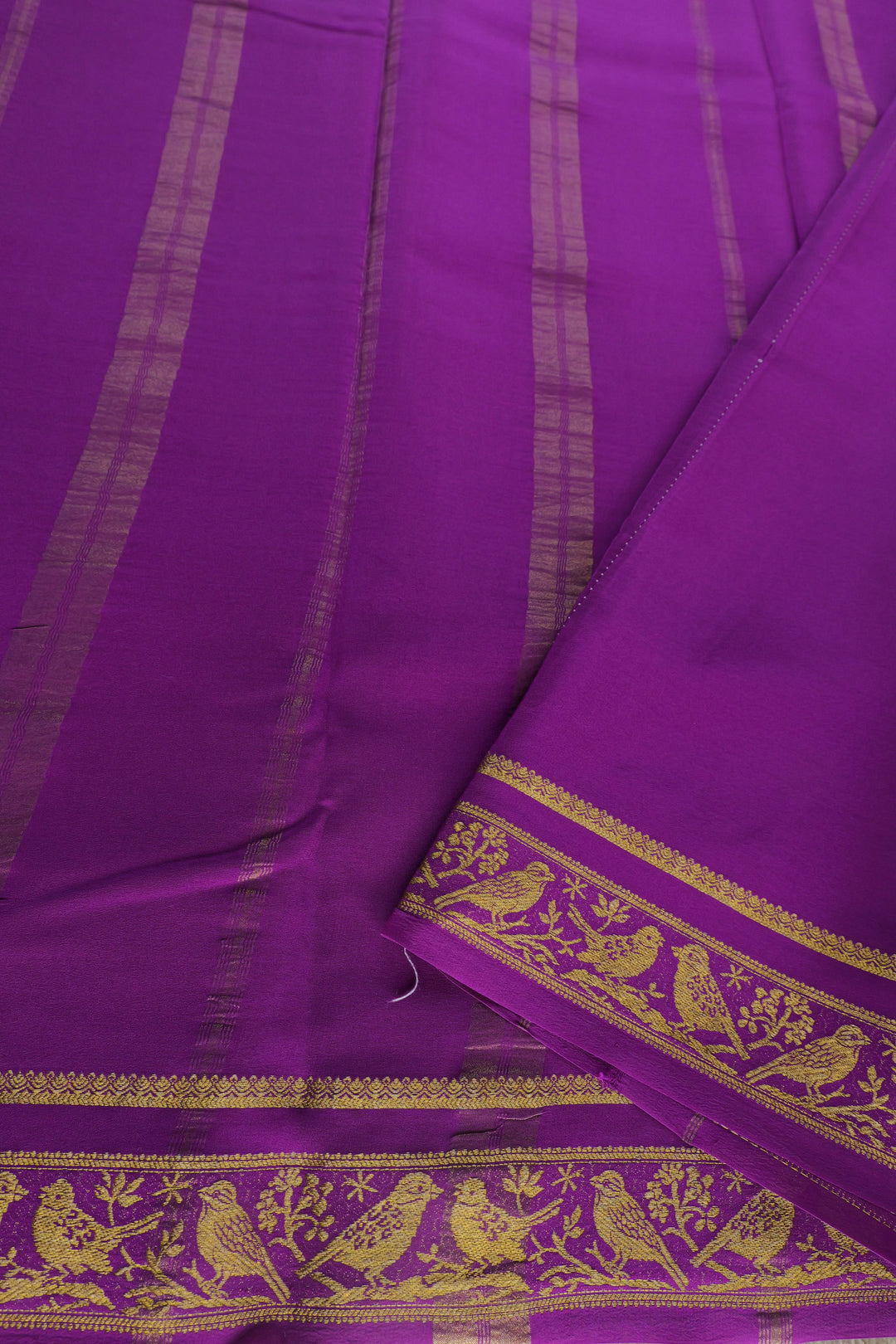 white Mysore silk saree with purple pallu and gold zari patterns